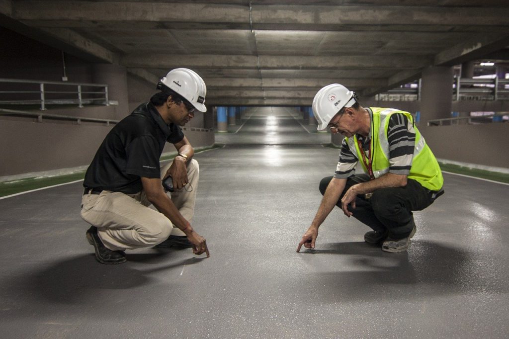 Commissioning agent inspecting work on construction job site